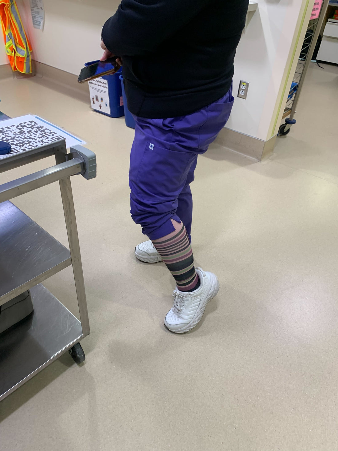 A nurse wearing Dr. Johnny's striped compression socks